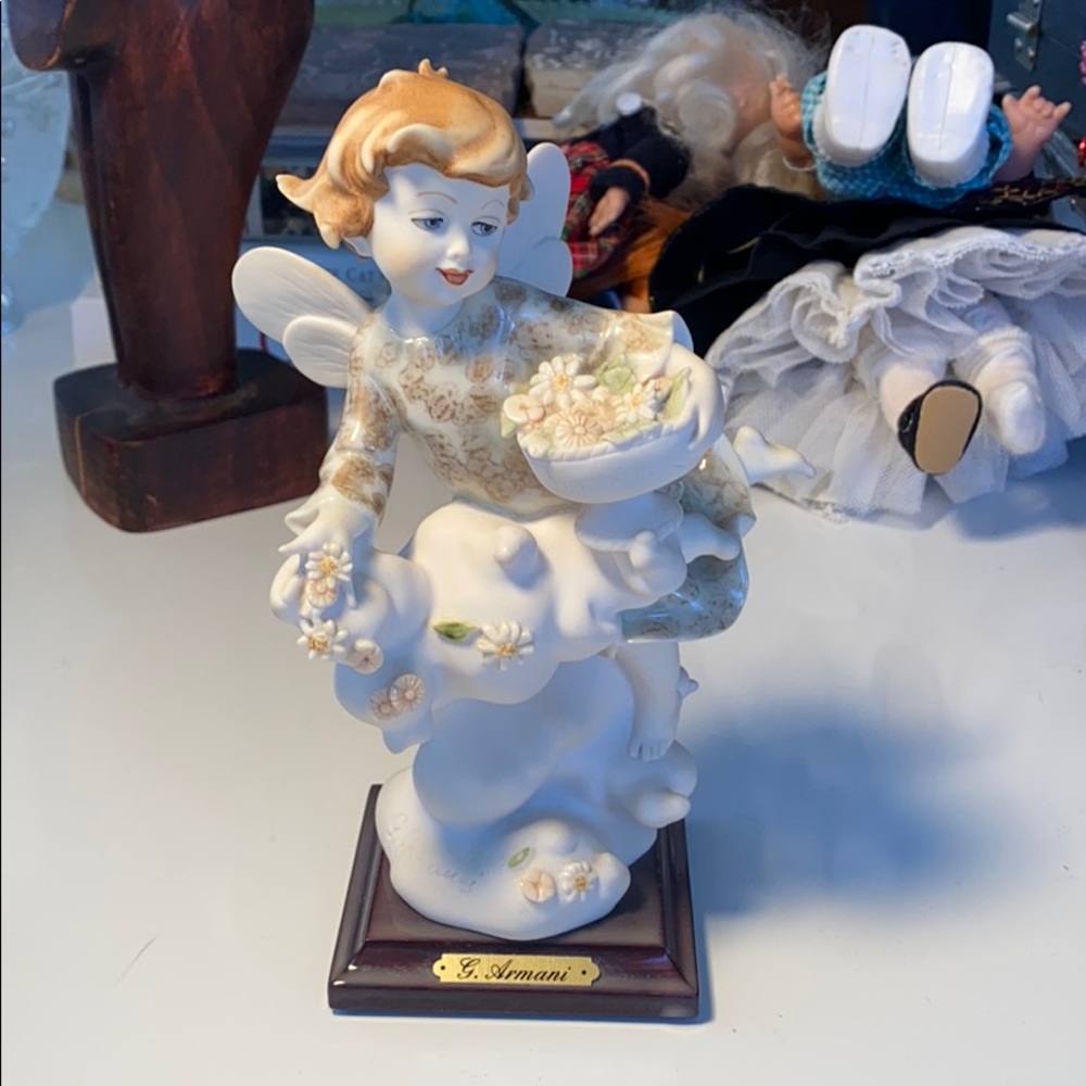 G. Armani fairy tossing flower figurine.